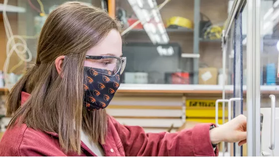 Kristen Travers working in a facility