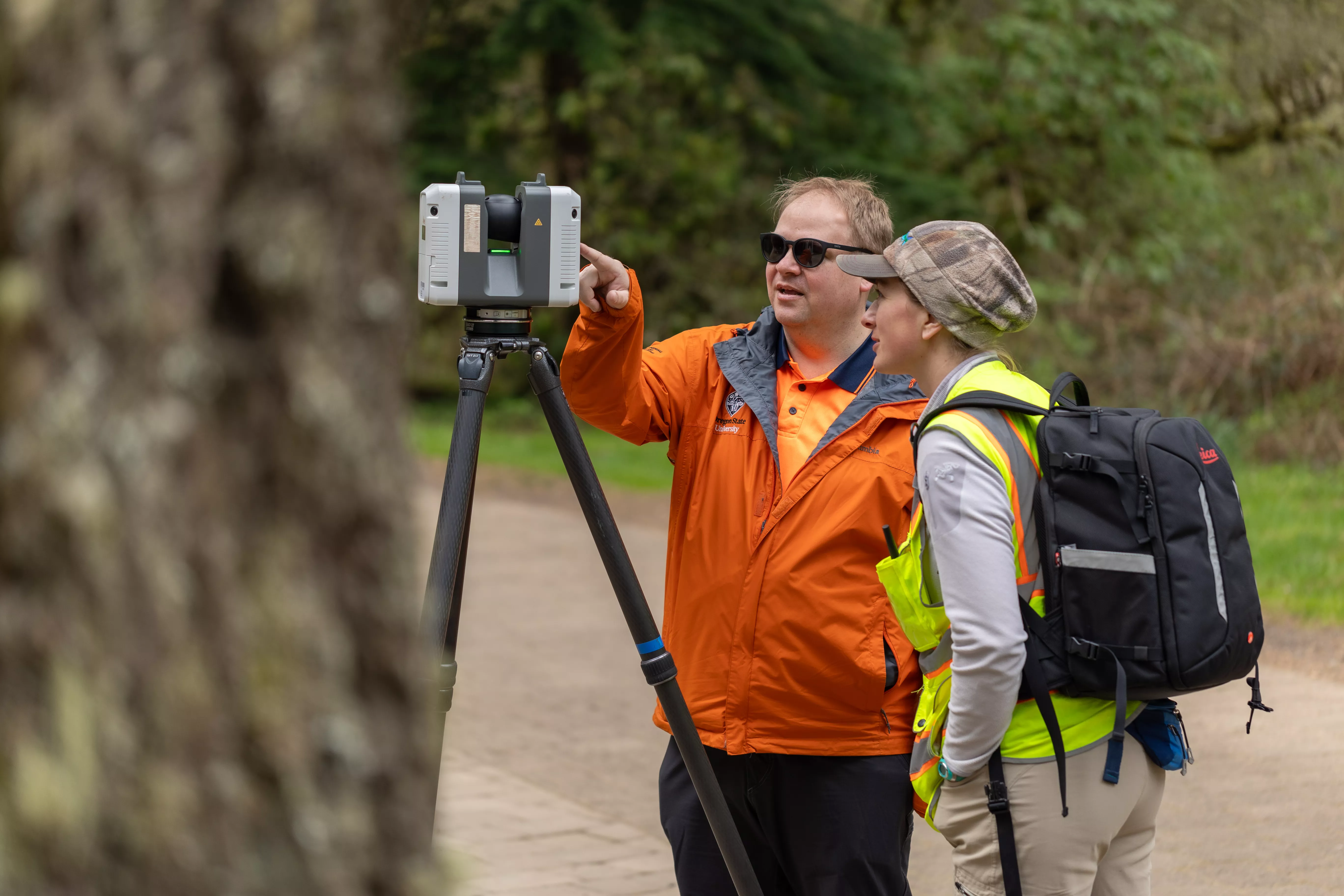 Researchers looking at 3D scanner at Silver Falls