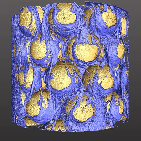 Glass beads covered with microbial biofilm