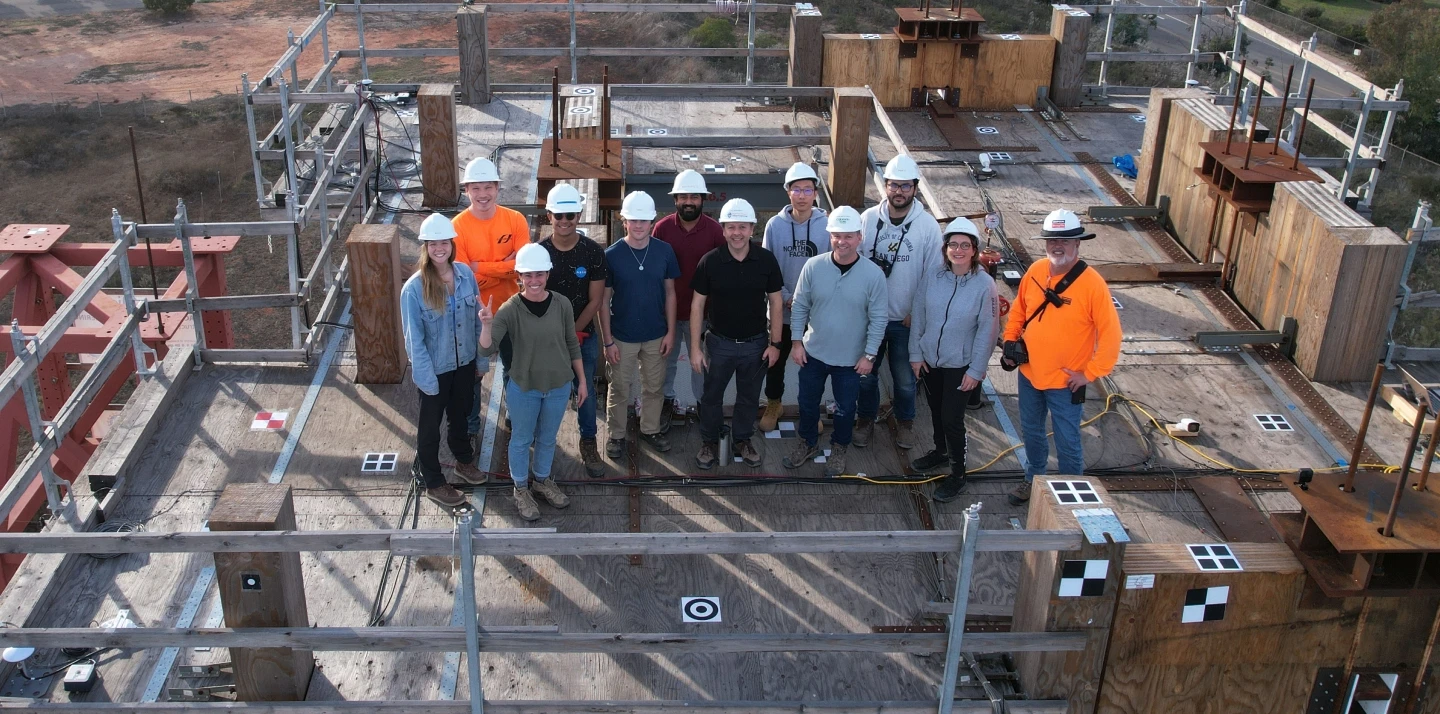 Construction workers posing as a group.