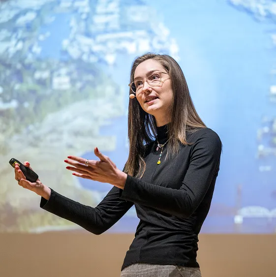 A speaker, giving a talk.