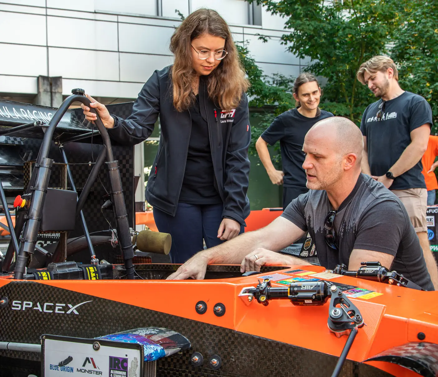 A robotics demonstration being done outdoors.