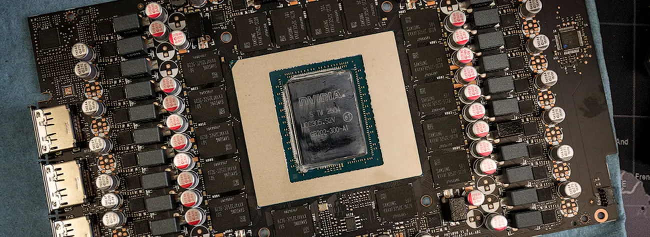 Close-up view of a graphics card chip board, showing the arrangement of the NVIDIA unit in the center, surrounded by other components.