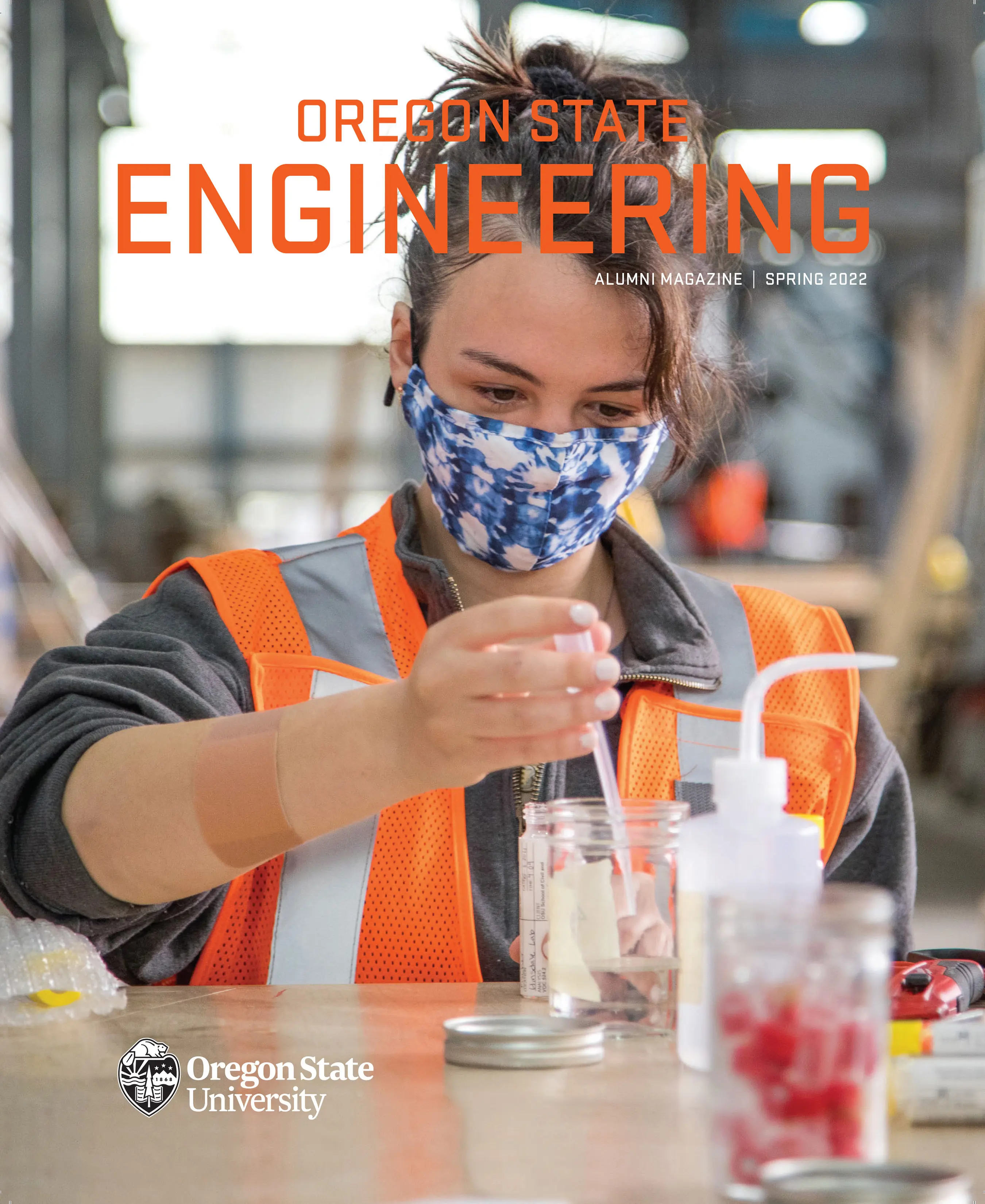 Magazine cover containing a person doing chemistry experiment, with oregon state engineering written on top