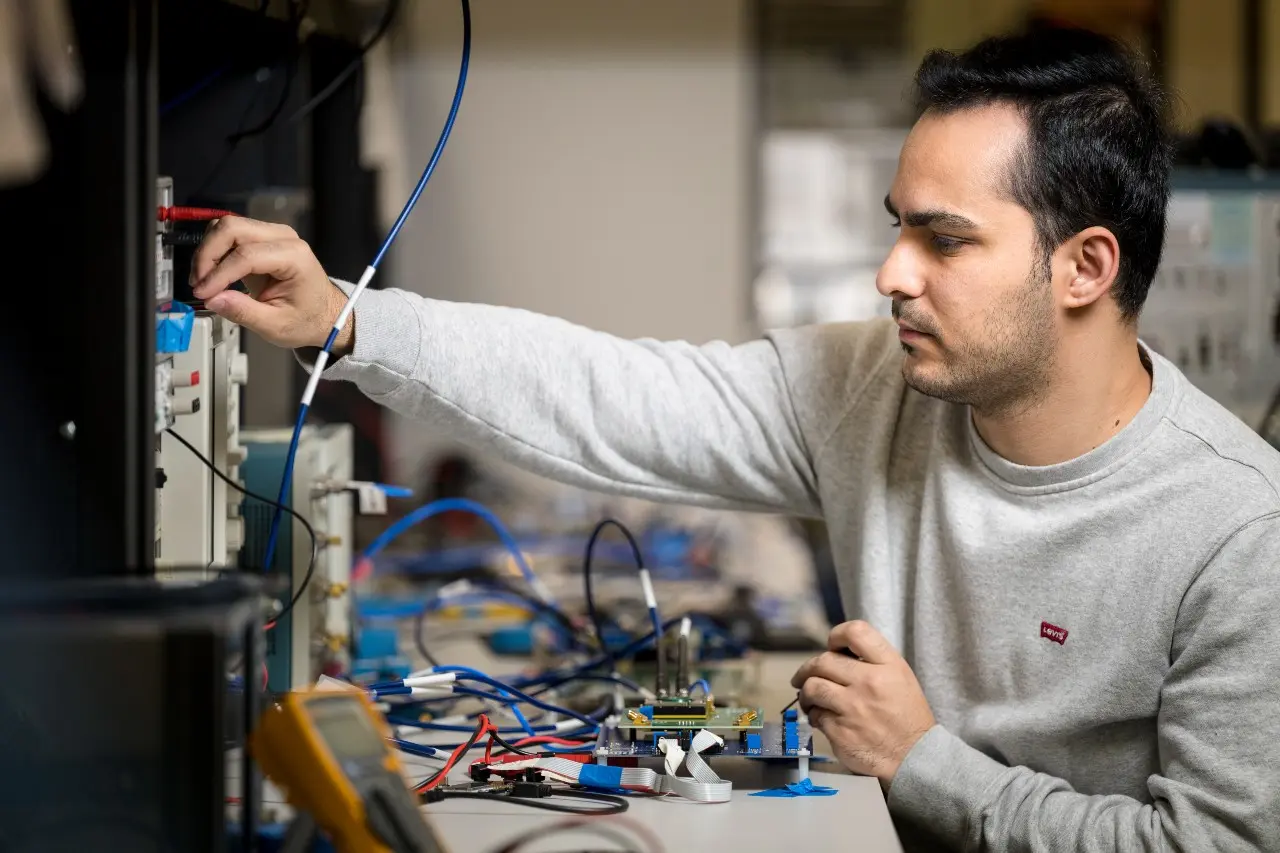 Student utilizing hardware tools.