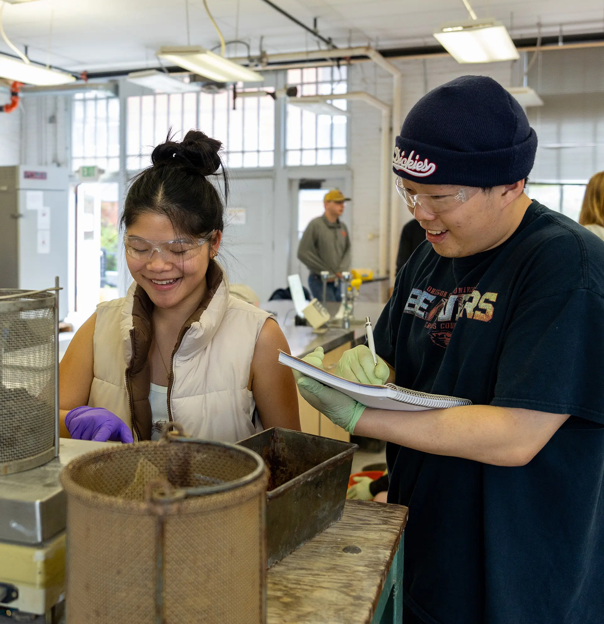 Two students working in a lab.
