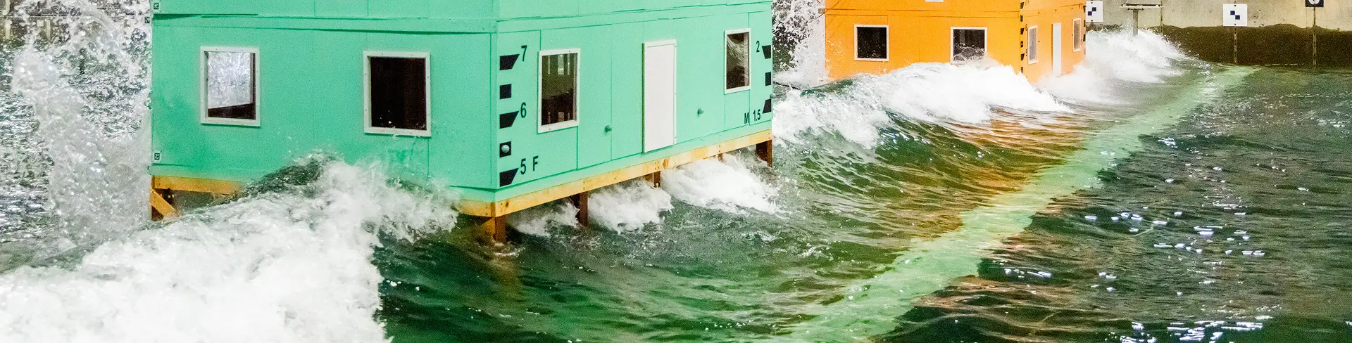 test buildings hit by waves in basin