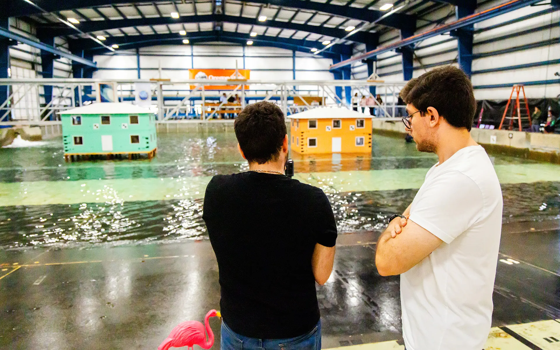 Two faculty examining the wave lab