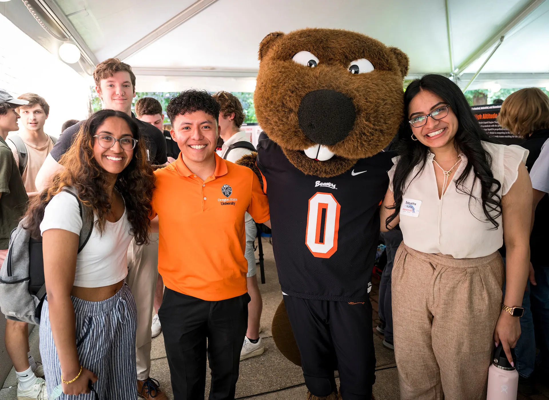 Students meeting with Benny the Beaver at 2025 engineering capstone expo.