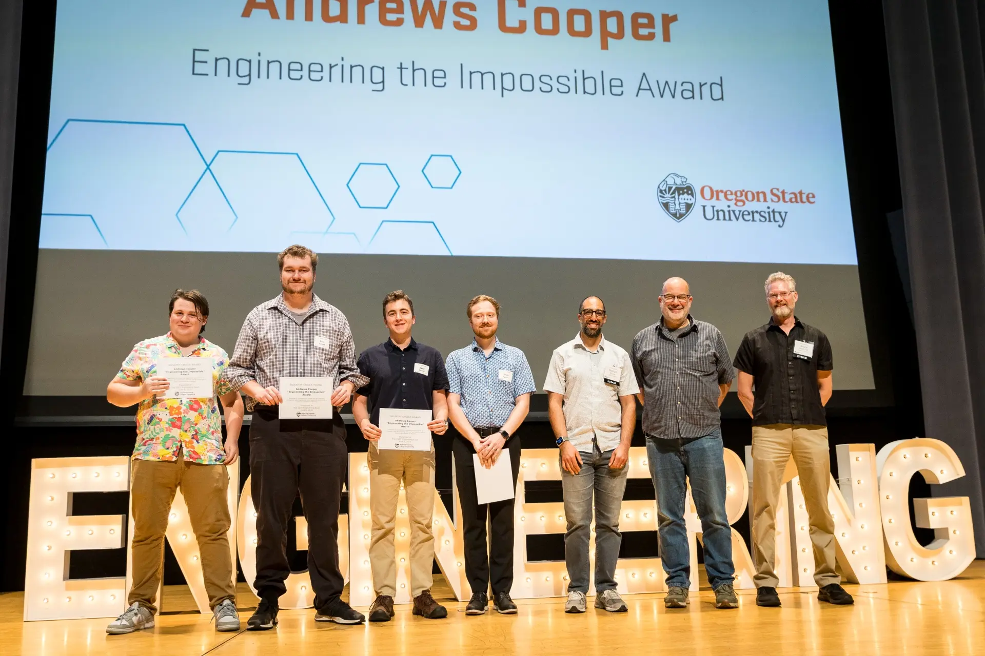 Students accept the 2025 Andrew Cooper award