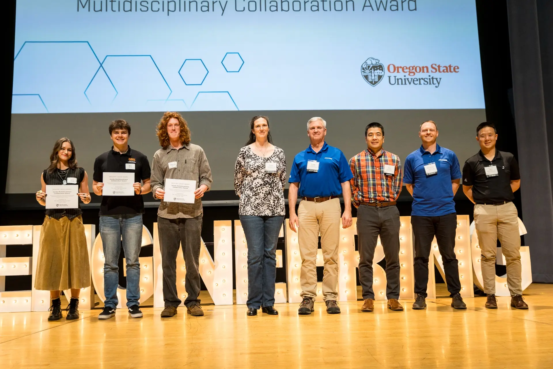 Students accept the 2025 Jacobs Multidisciplinary Collaboration Award
