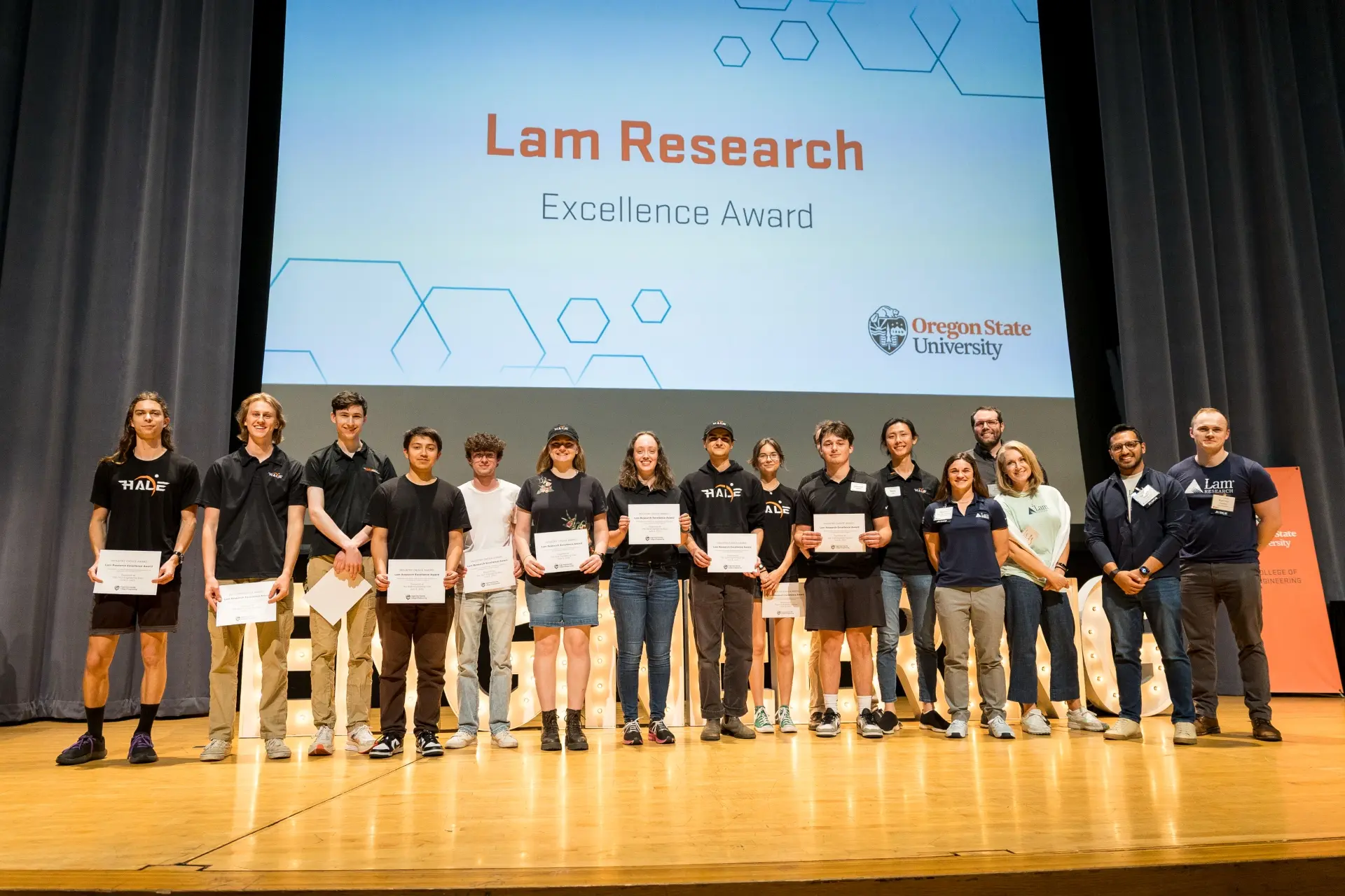 Students accept the 2025 Lam Research Excellence Award