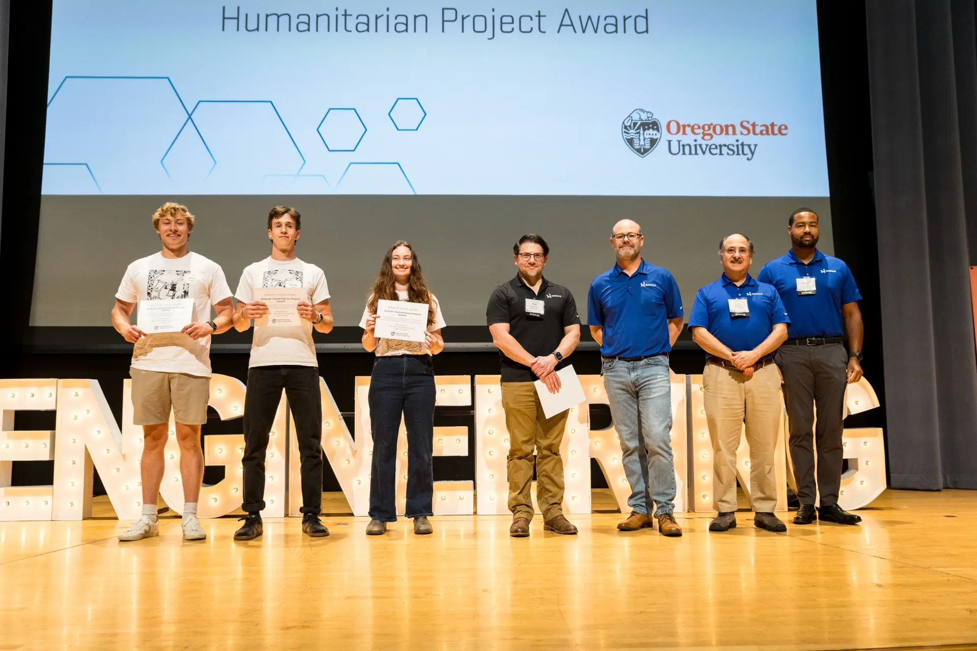 Students accept the 2025 NuScale Humanitarian Project Award