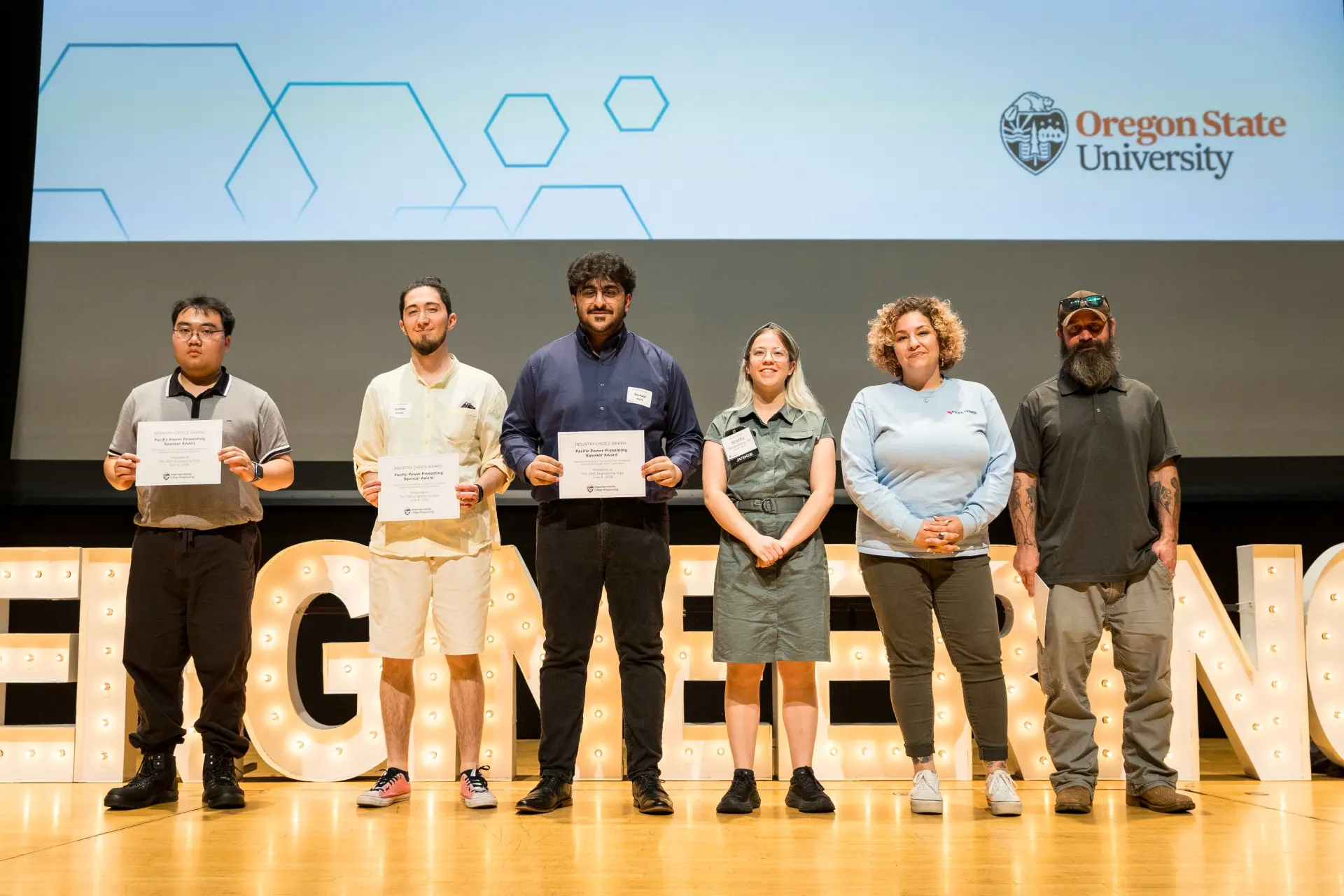 Students accept the 2025 Pacific Power Presenting Sponsor Award