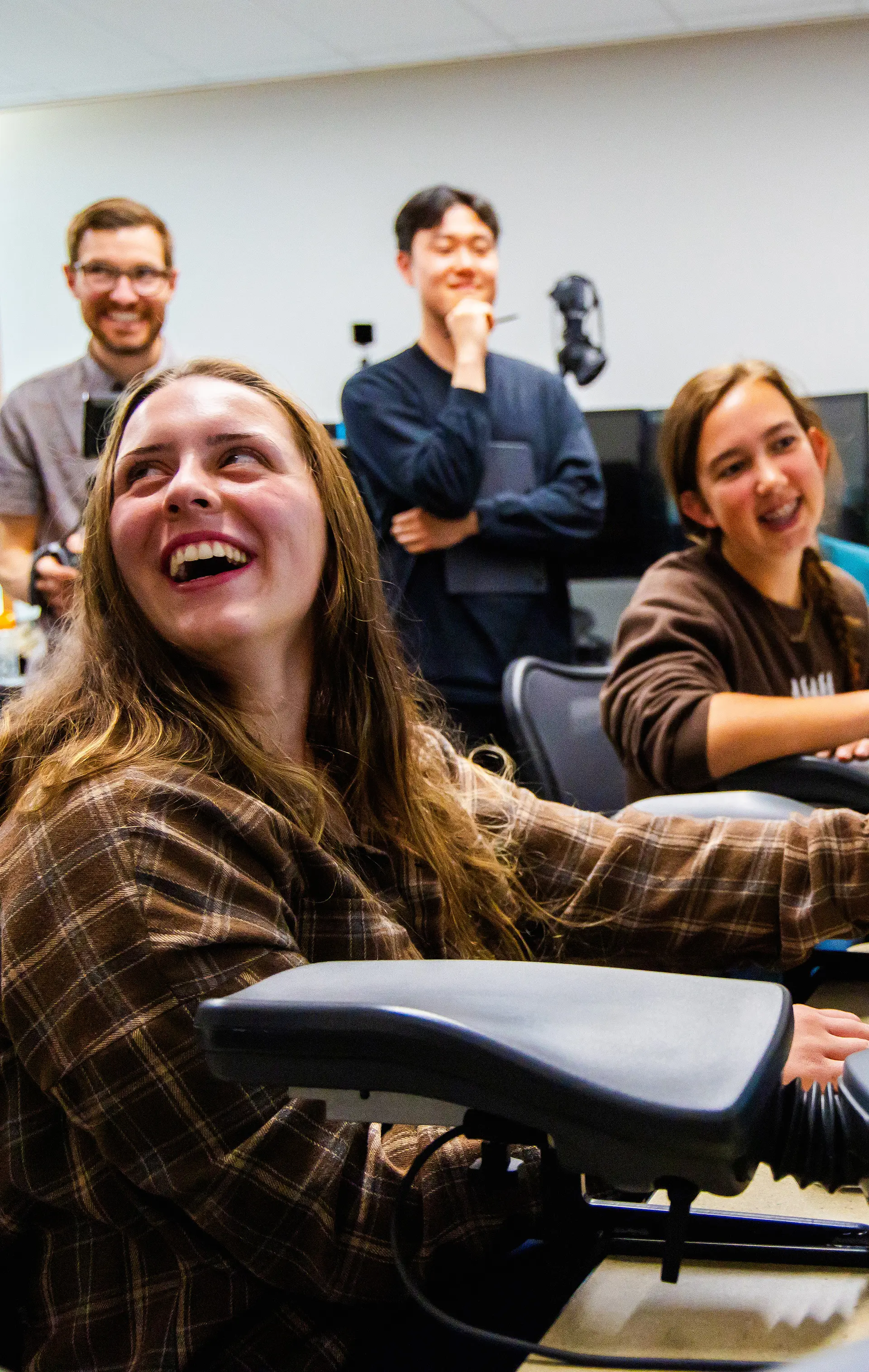 Four students in a classroom.