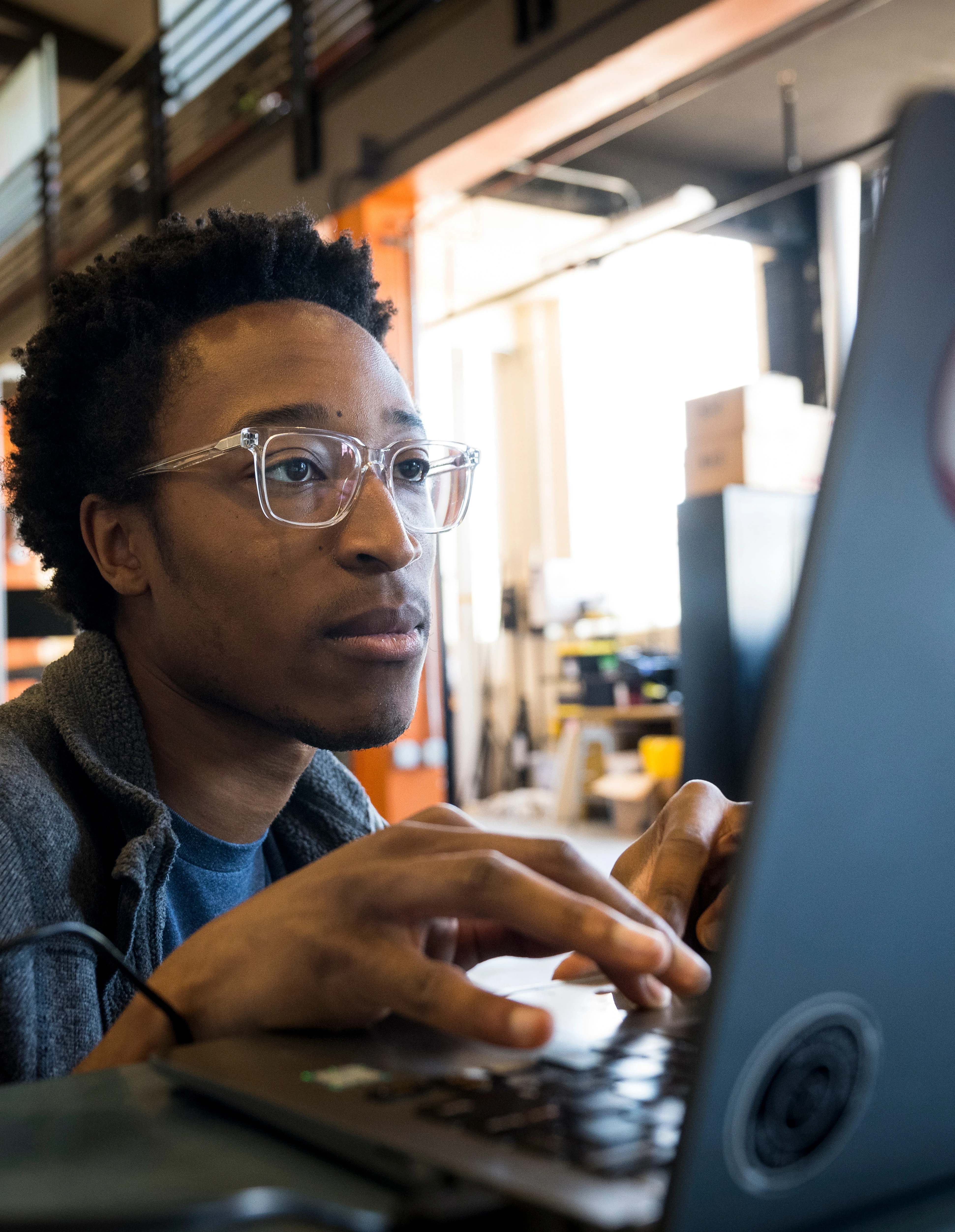 A student looking at his laptop.