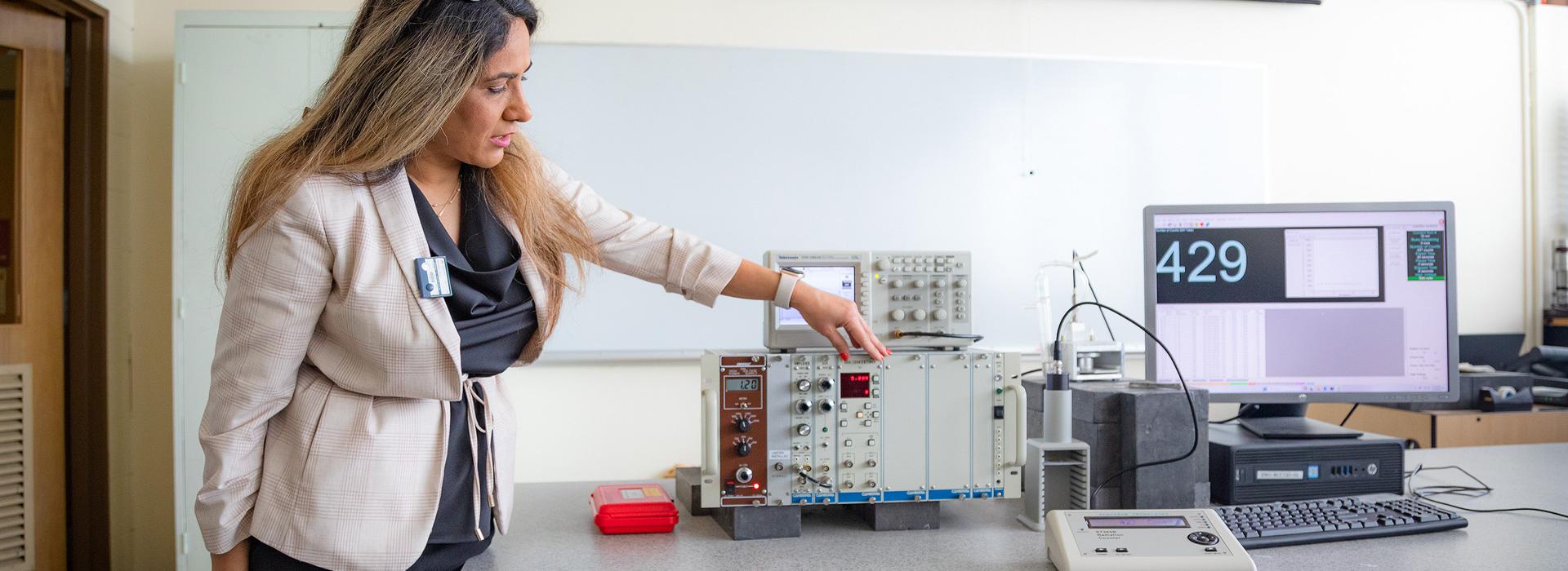 faculty member working in a lab.