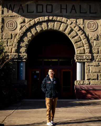 Aaron Mendez in front of Waldo Hall.