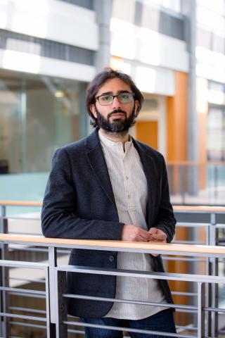 Researcher in a suit.