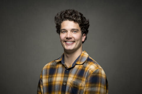 Portait of Watt Brown in yellow checked shirt