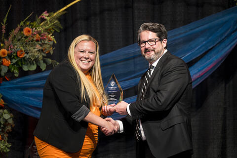 Lauren Holmes accepts award
