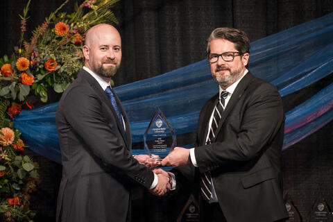 Matthew R. Johnson accepts award