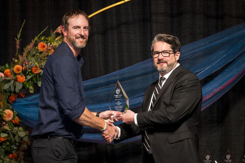 Michael Kennedy accepts award