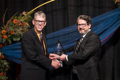 Peter Koonce accepts award
