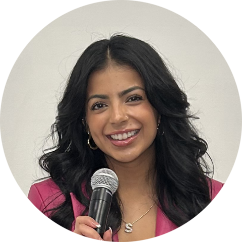 Sonia Camacho holding a microphone.