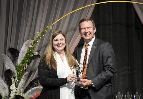 Ashley Mason recieving award from Scott Ashford.