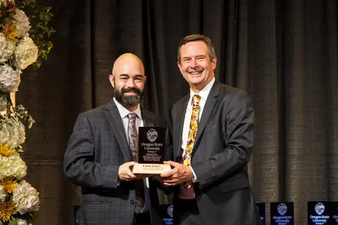 R. Brian Jackson receiving award from Scott Ashford.