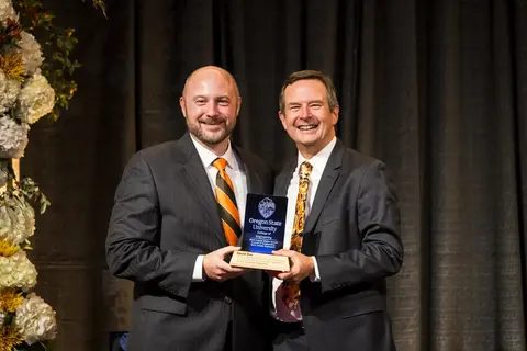 David Zier receiving award from Scott Ashford.