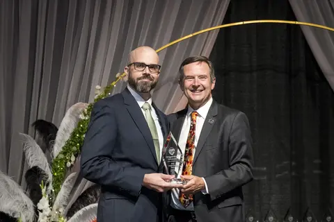 Jack Gilchrist recieving award from Scott Ashford.