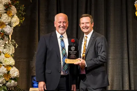 John McRae recieving award from Scott Ashford.
