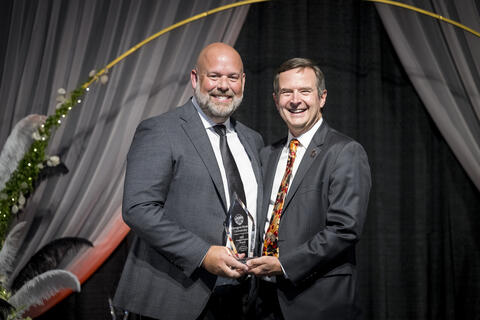 Larry Martin receiving award from Scott Ashford.