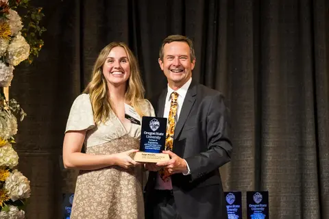 Paige Molzahn receiving award from Scott Ashford.