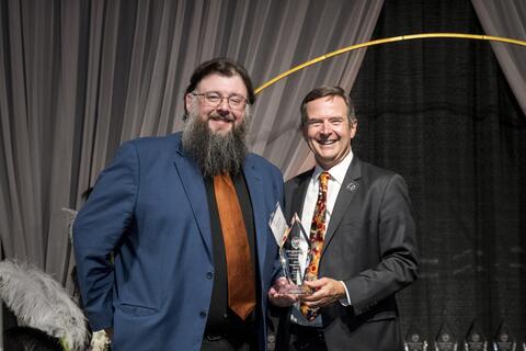 Patrick Marnell receiving award from Scott Ashford.