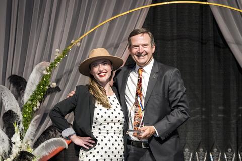 Sydney Forbes receiving award from Scott Ashford.
