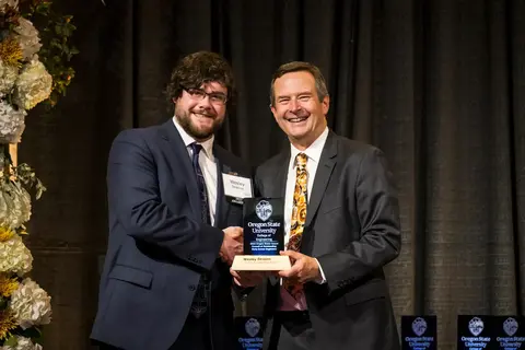Wesley Deason receiving award from Scott Ashford.