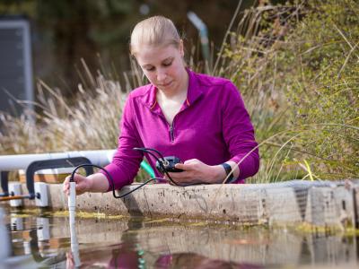 A student analyzing water. 