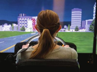 A student testing a driving simulation.