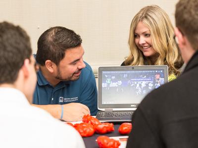 Photo of company representatives talking with students