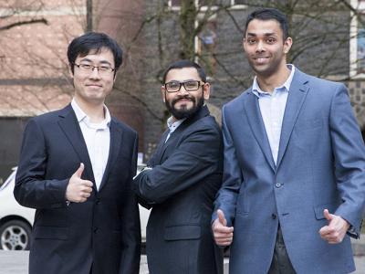 Tree faculty members wearing suits. 