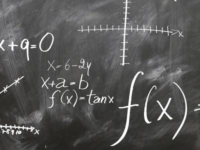 A blackboard with mathematic symbols on it.