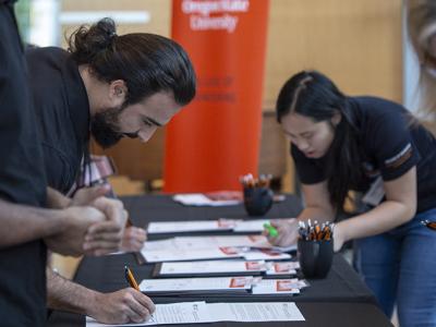 Students registering for networking night.