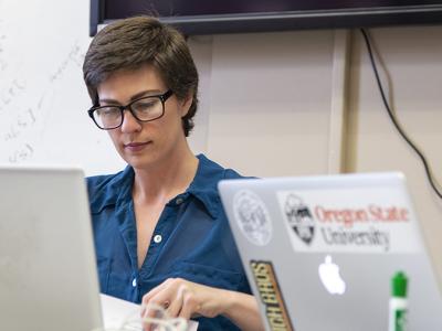 A person in front of a laptop.