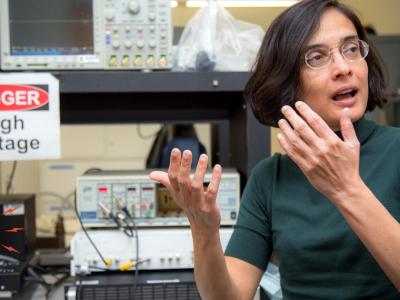 Associate Professor Pallavi Dhagat sitting at a desk.