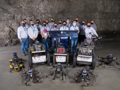 Members of Team Explorer rally behind their banner at the final round of competition, held in September in Louisville