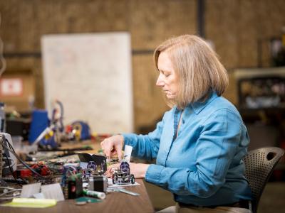 Faculty member Julie Adams in a lab.