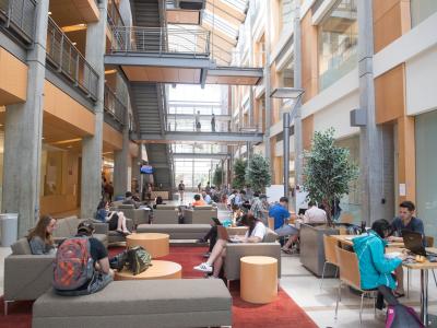 Students sitting in the atrium of Kelley Engineering.